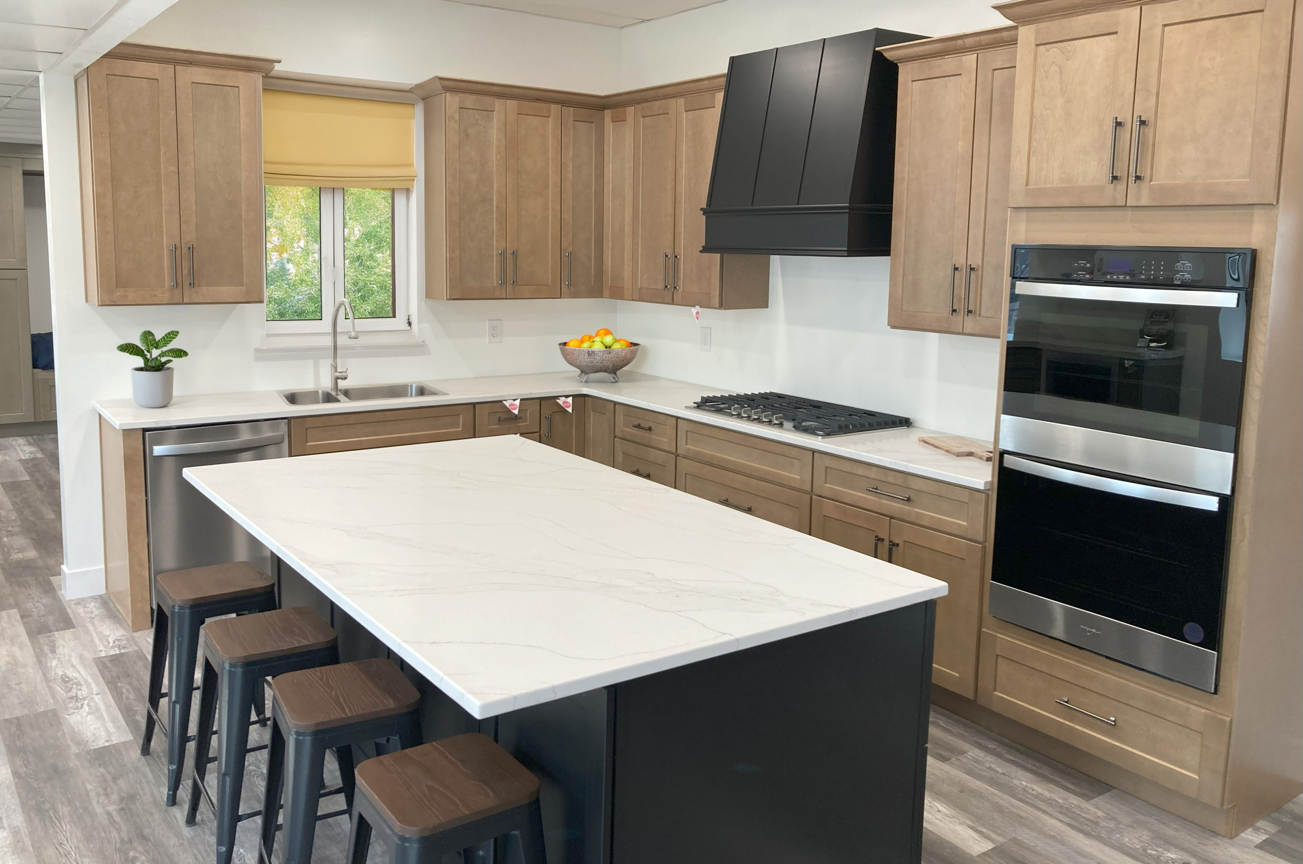 A kitchen with an island for seating