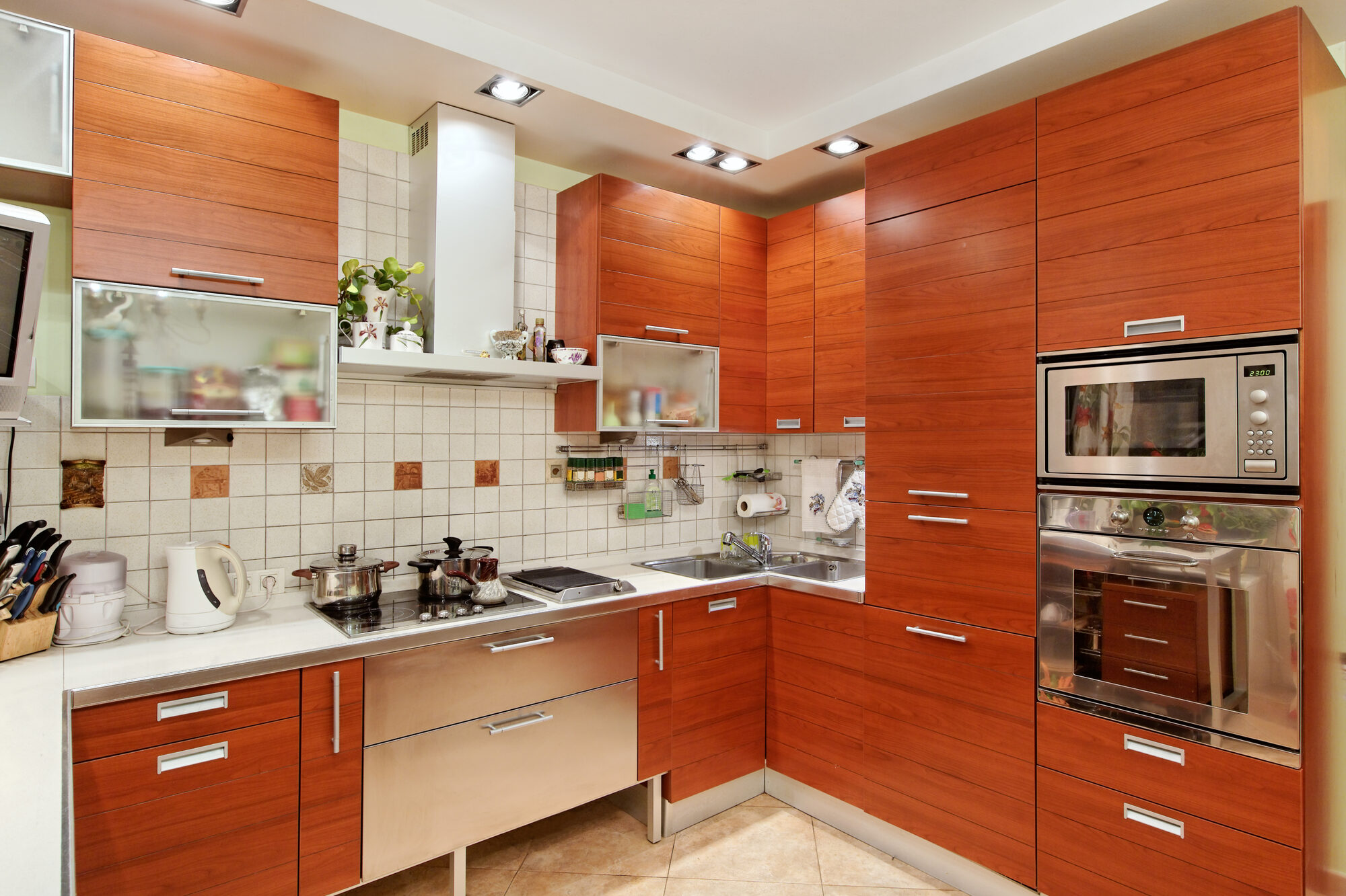 Kitchen interior with wooden furniture and build in utensils Cabinet Corner