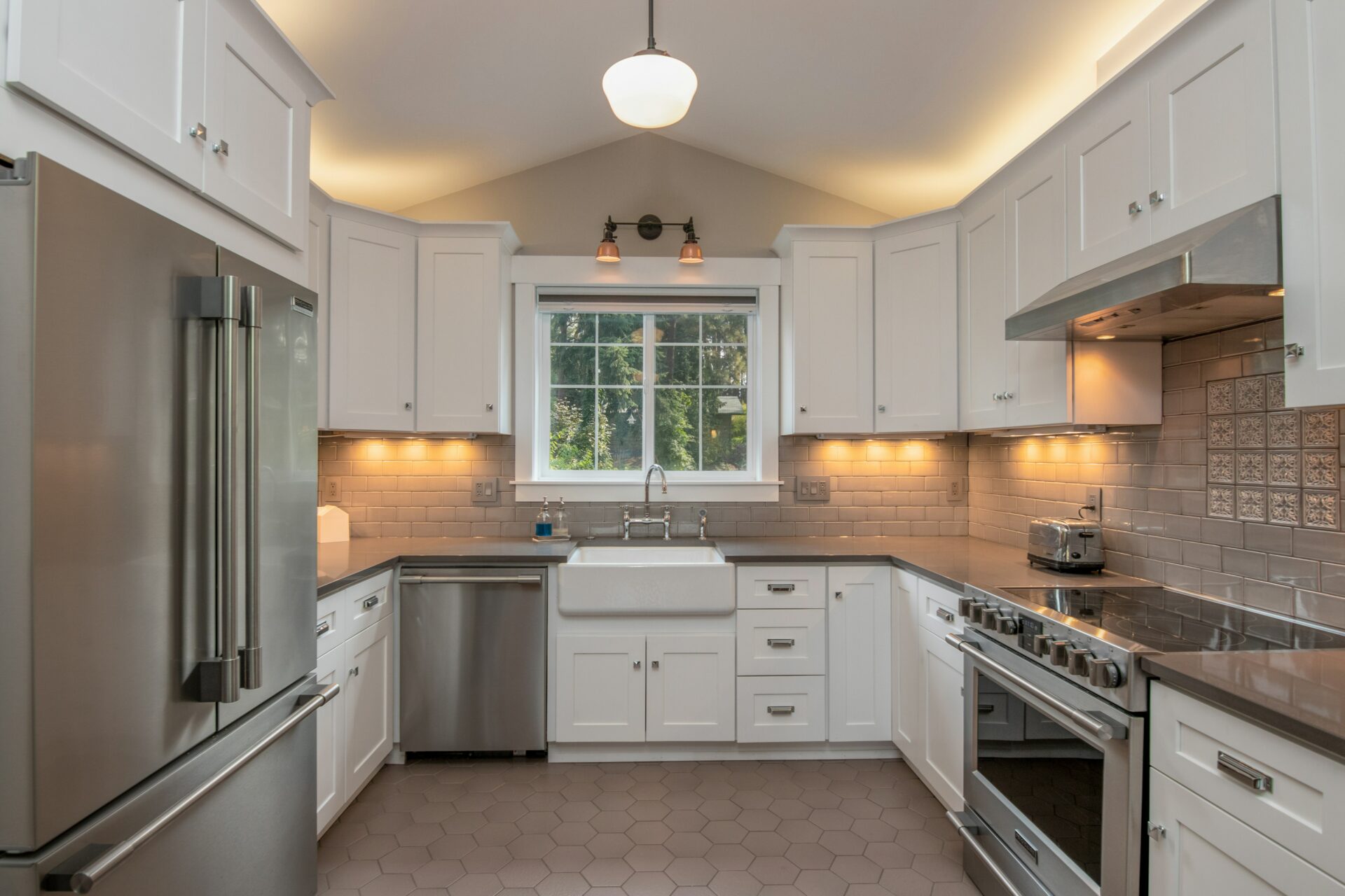 A modern kitchen with white cabinets